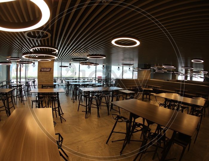 Cafeteria With Interior Chairs And Tables