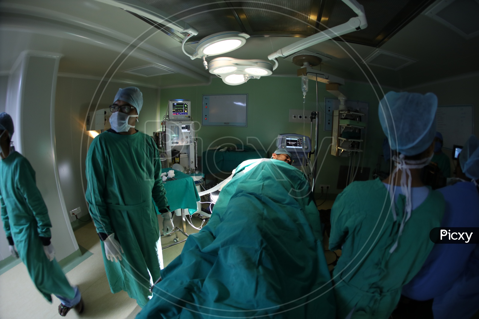 Doctor Treating Patient In Operation Theater or  ICU  in a  Hospital