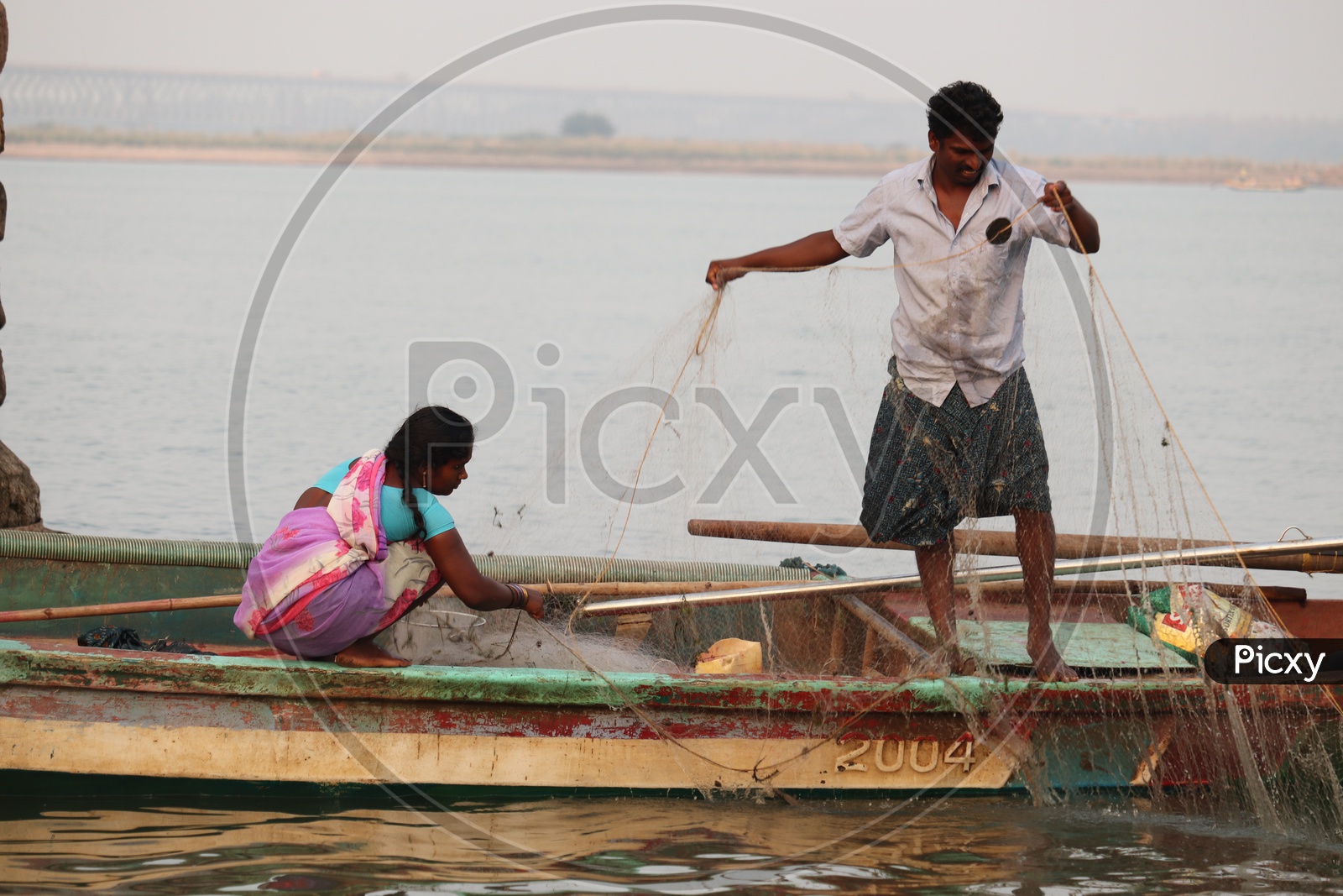 Man and his wife working hard for livelihood!