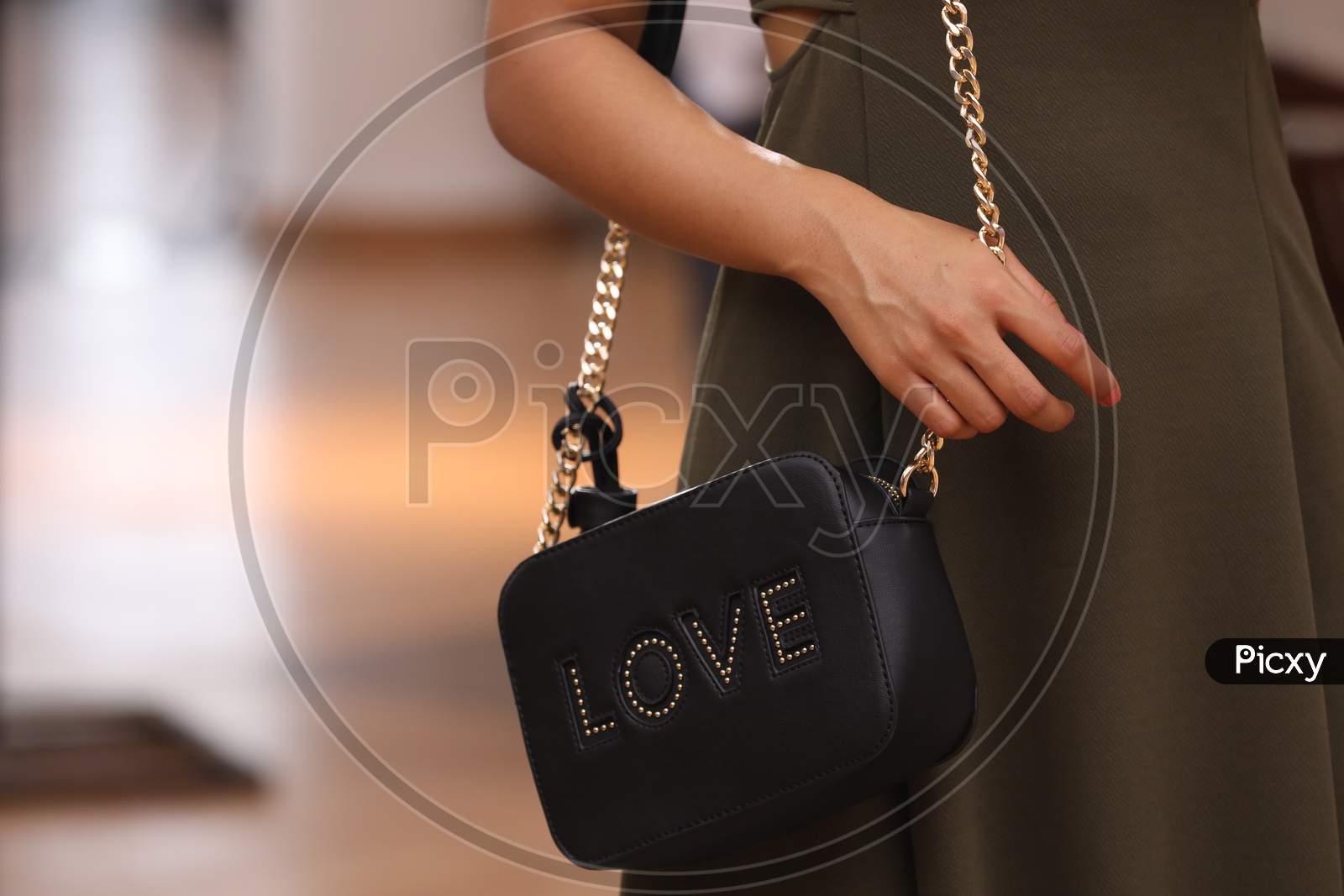Pretty Woman With a Sling Bag Or Hand Bag Hanging To her Shoulder Closeup