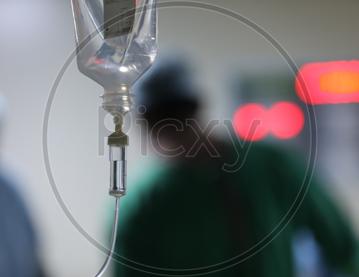 Saline Bottle Or Pouch Hanging To a Stand In a  Hospital Ward