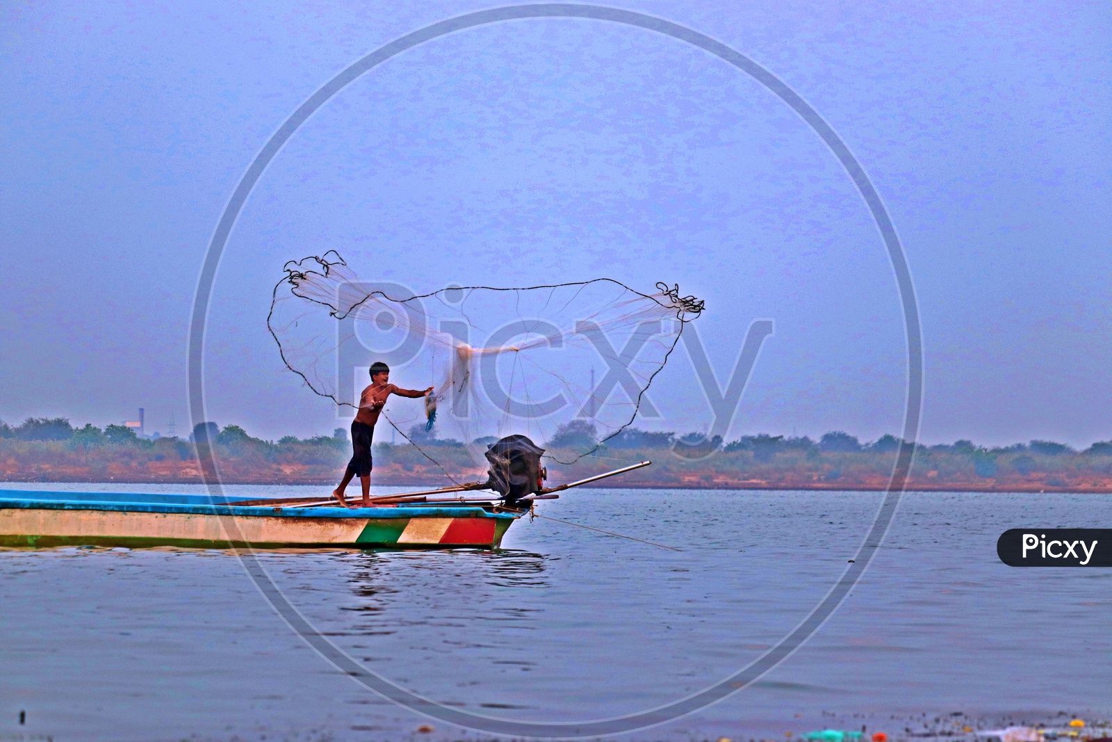 fishermen spinning his kind of web for livelihood !