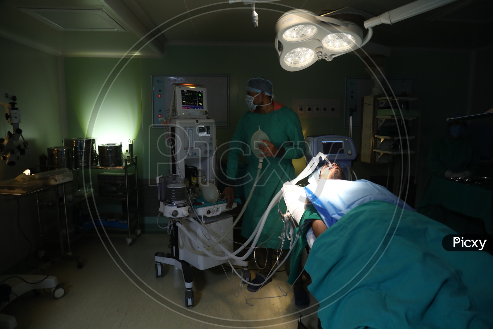 Hospital Operation Theater Or  ICU  With Doctor Treating The Patient