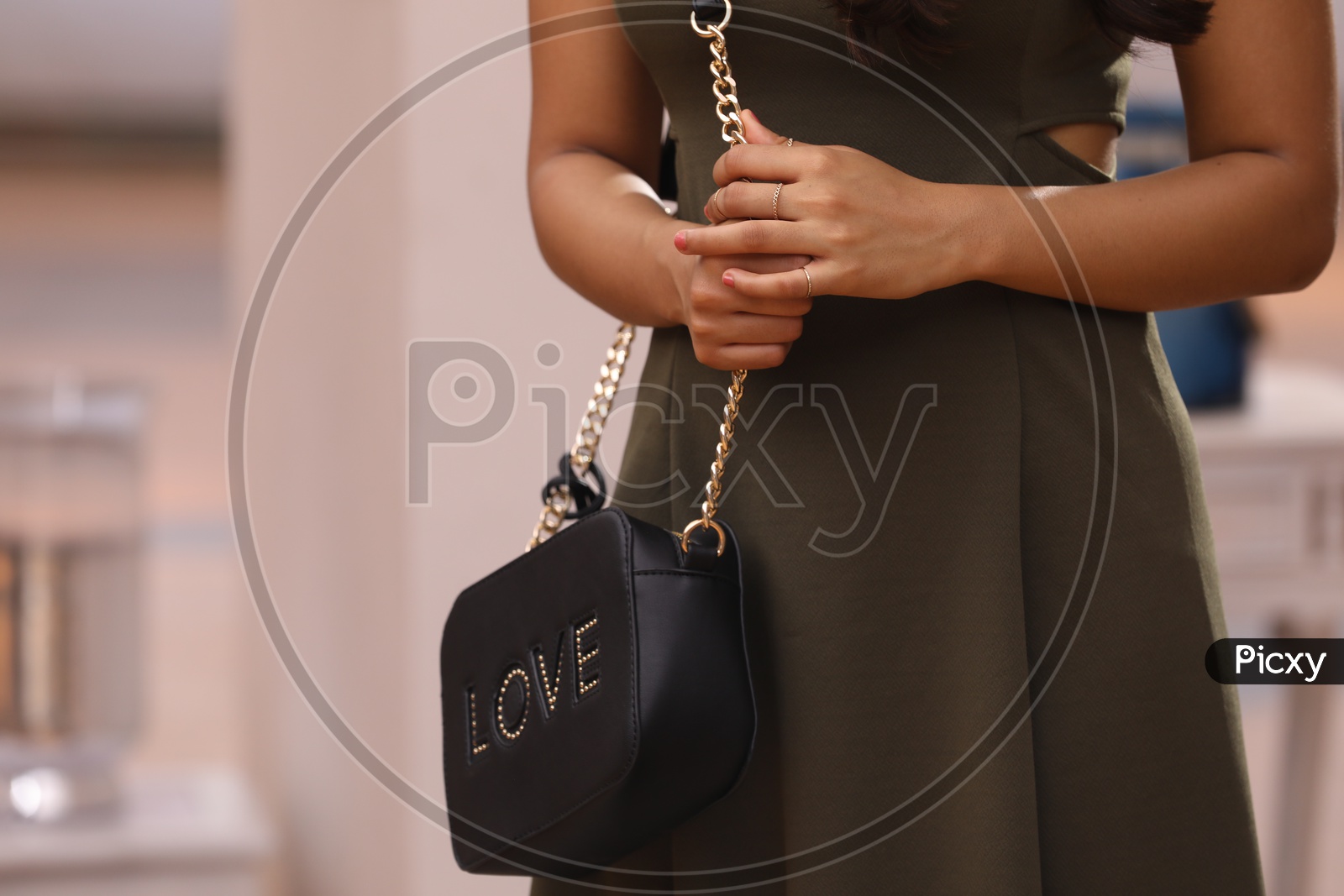 A Pretty Woman Or Girl  With Sling Bag Or Hand Bag  to  Her Shoulder Closeup