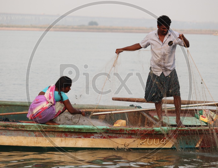 Man and his wife working hard for livelihood!