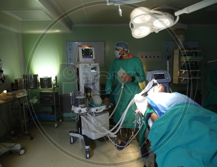 Hospital Operation Theater Or  ICU  With Doctor Treating The Patient