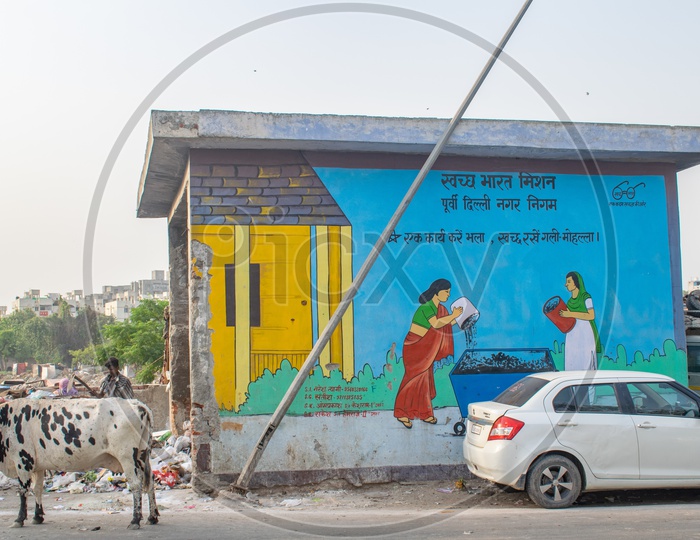 Dumping site for garbage and "Swachh Bharat mission" advertisement at the wall