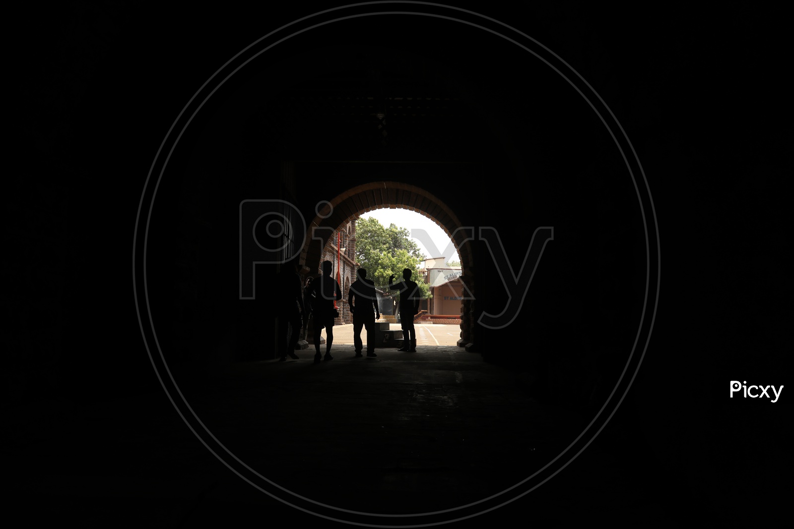 Silhouette Of People  Standing   in  a Corridor
