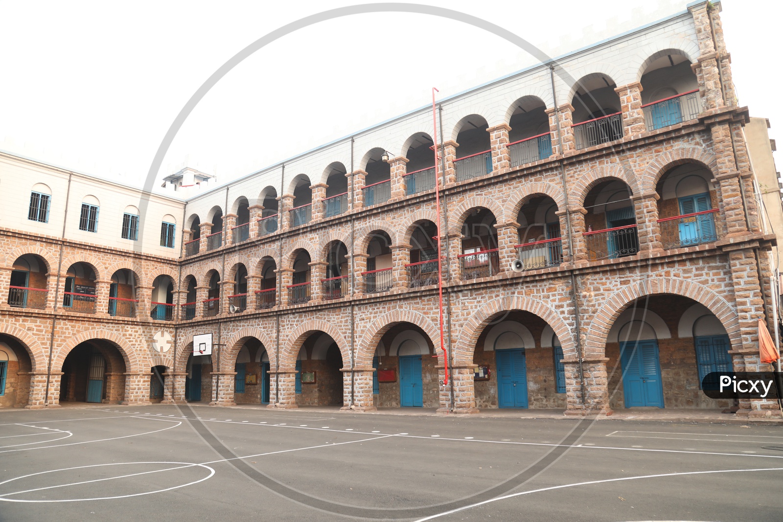 An Old School With  A Basket Ball Court