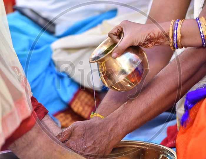 Bride Parents Washing Bridegrooms Legs In a Bowl  In Telugu Weddings
