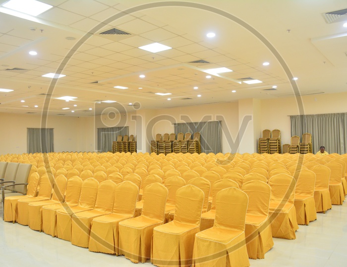 Chairs Arranged In Rows At a Function Hall Or  Convention Hall