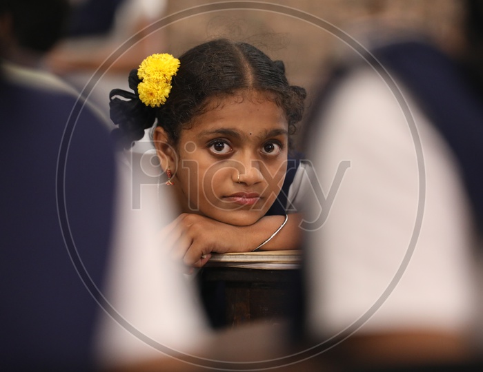 Girl Student Sitting In a Classroom