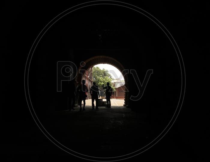 Silhouette Of People  Standing   in  a Corridor