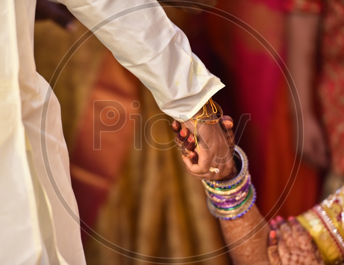 Bridegroom Holding The Bride Hand