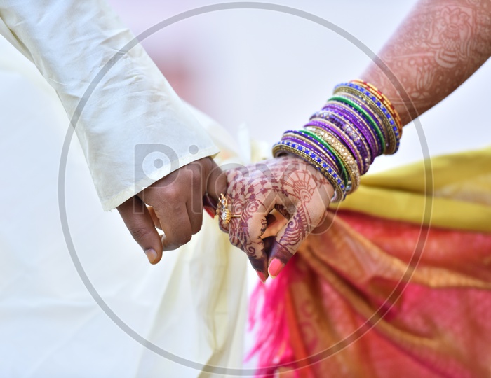 Bride And Groom Holding Hands In a Wedding  or Marriage