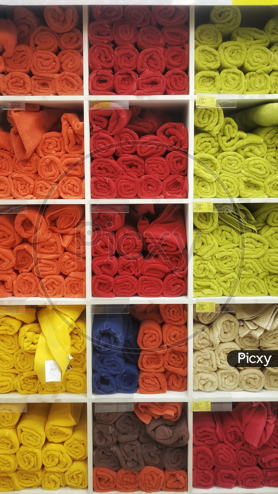 Many types of towels and textile products for sale in supermarket