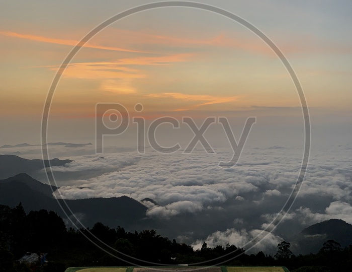 A Beautiful View Of Clouds Over Valley In Kodaikanal