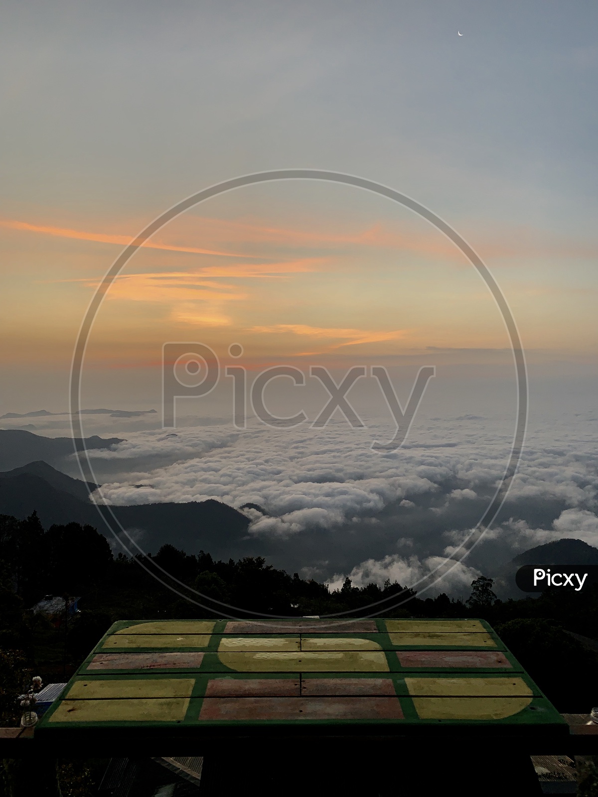A Beautiful View Of Clouds Over Valley In Kodaikanal