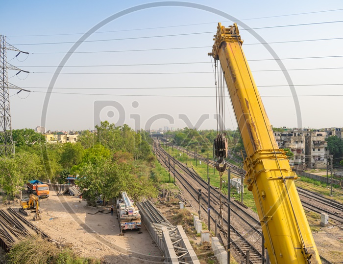 Crane machine and Construction work near railway line