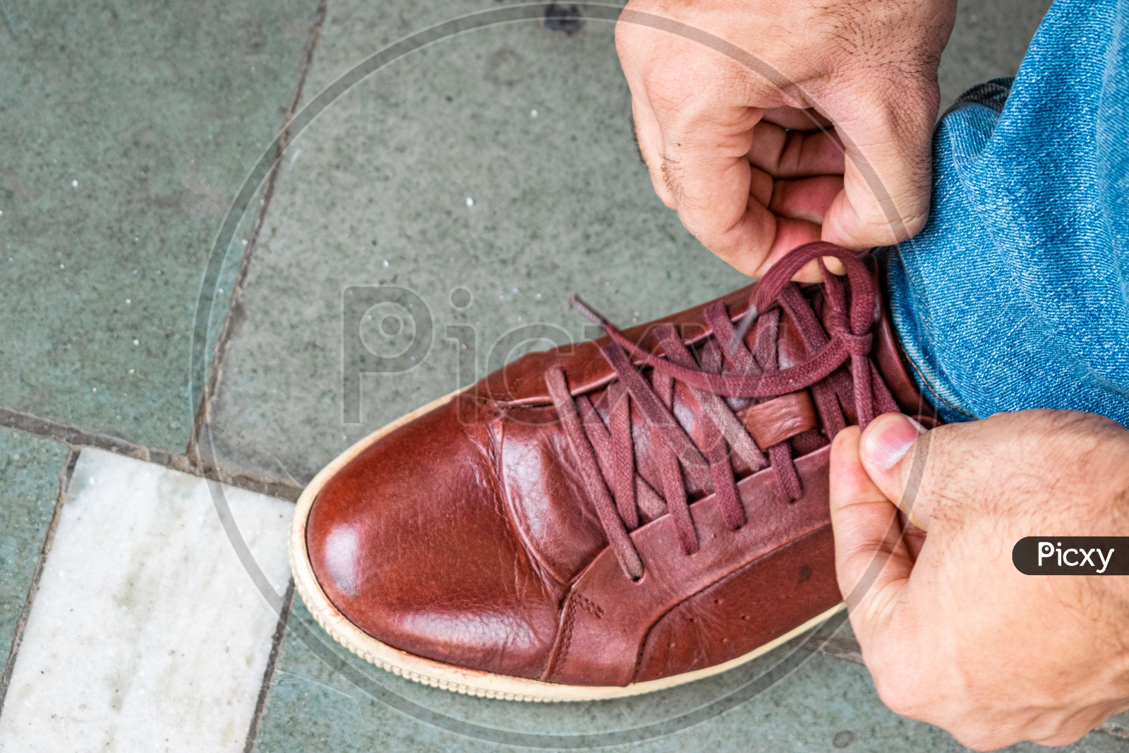 Tying shoelaces after getting it polished