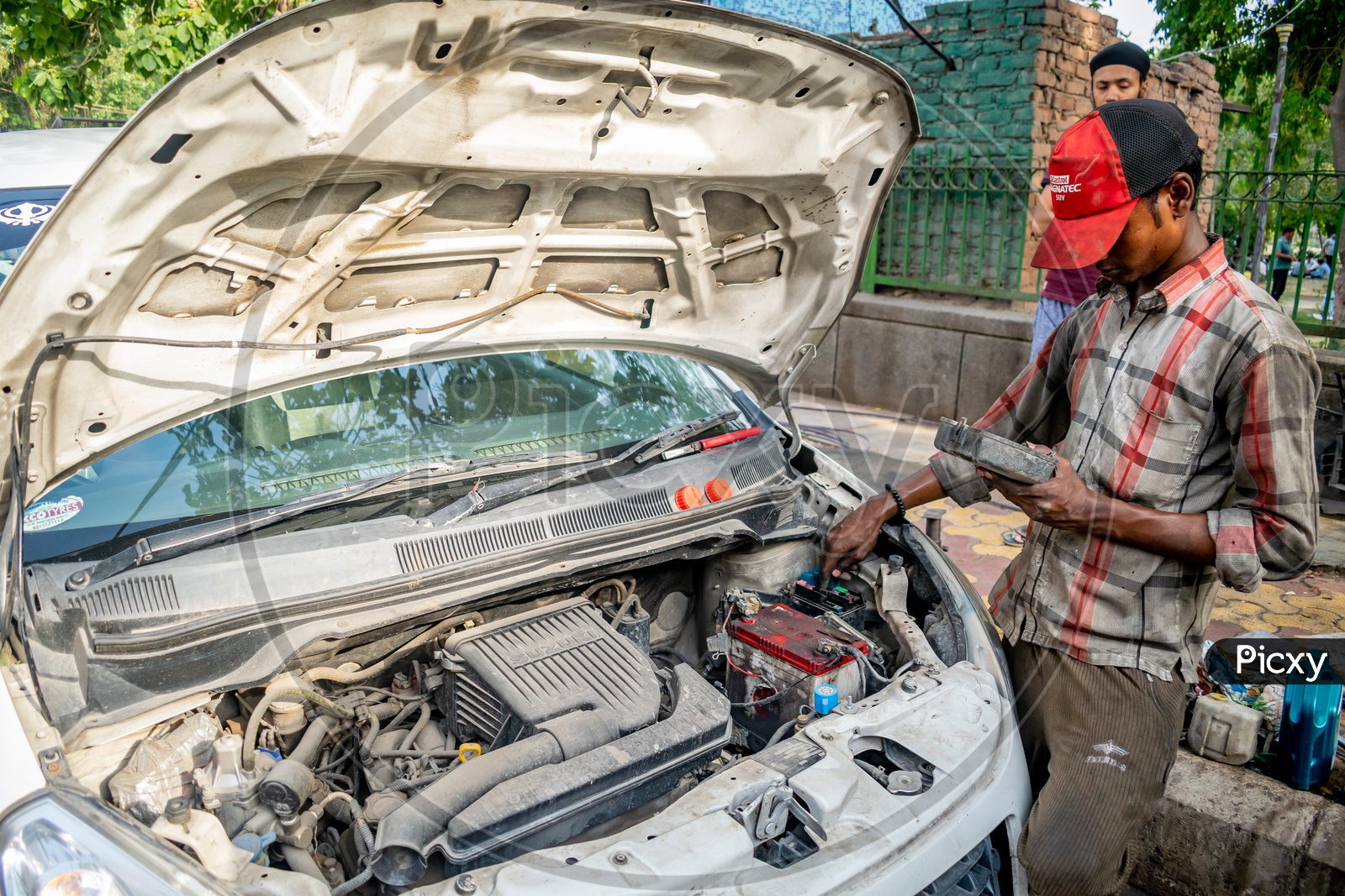 A mechanic repairing a car