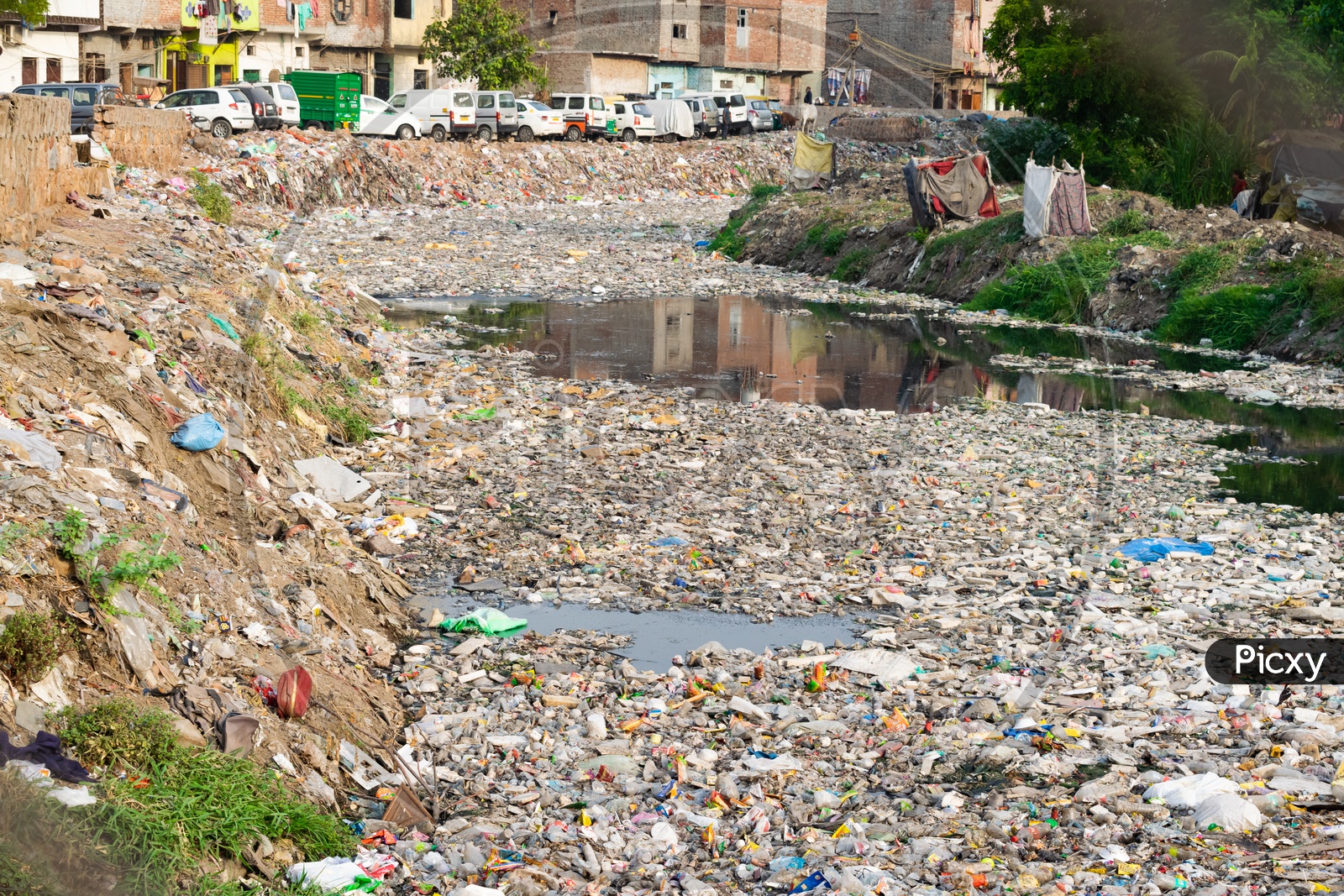 Garbage(waste) in a water channel/Water Pollution/Bad Sewage