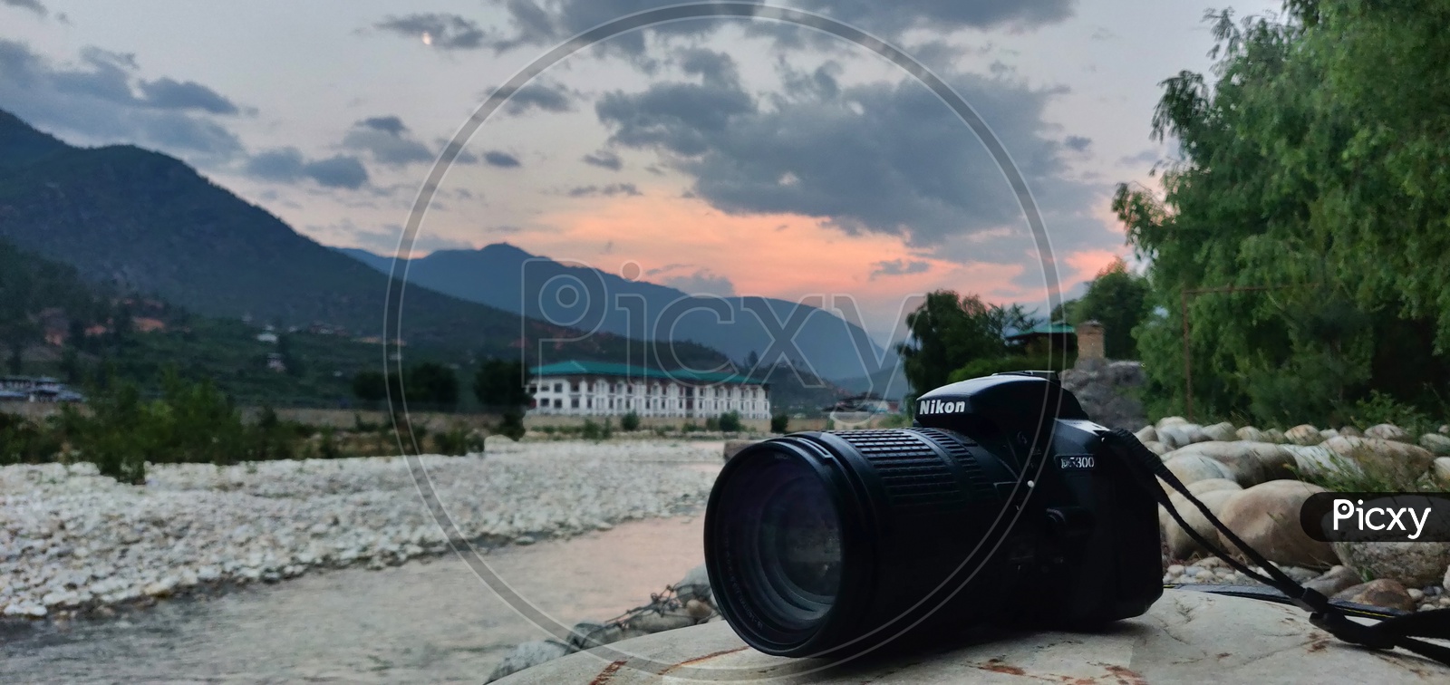 camera and beautiful sunset in the background