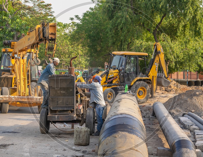 Crane Machine and JCB on a construction site near Pragati Maidan, Delhi