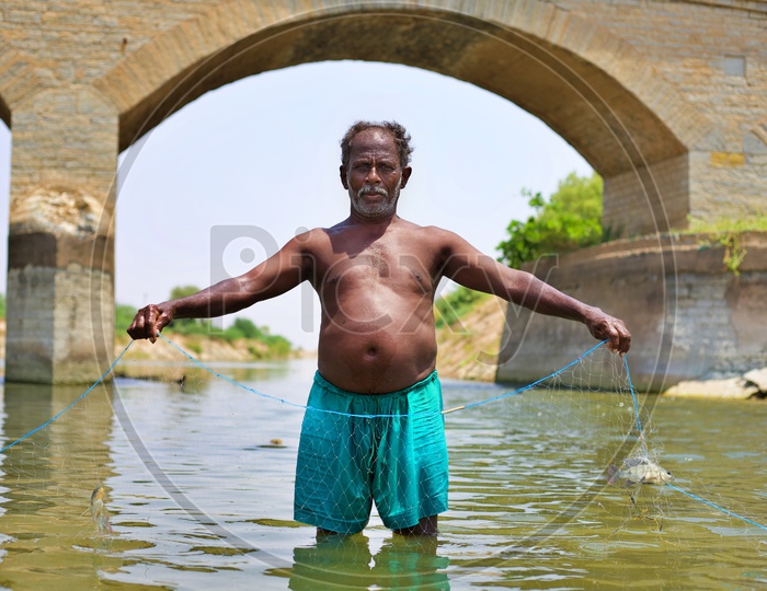A fisher man with his net.