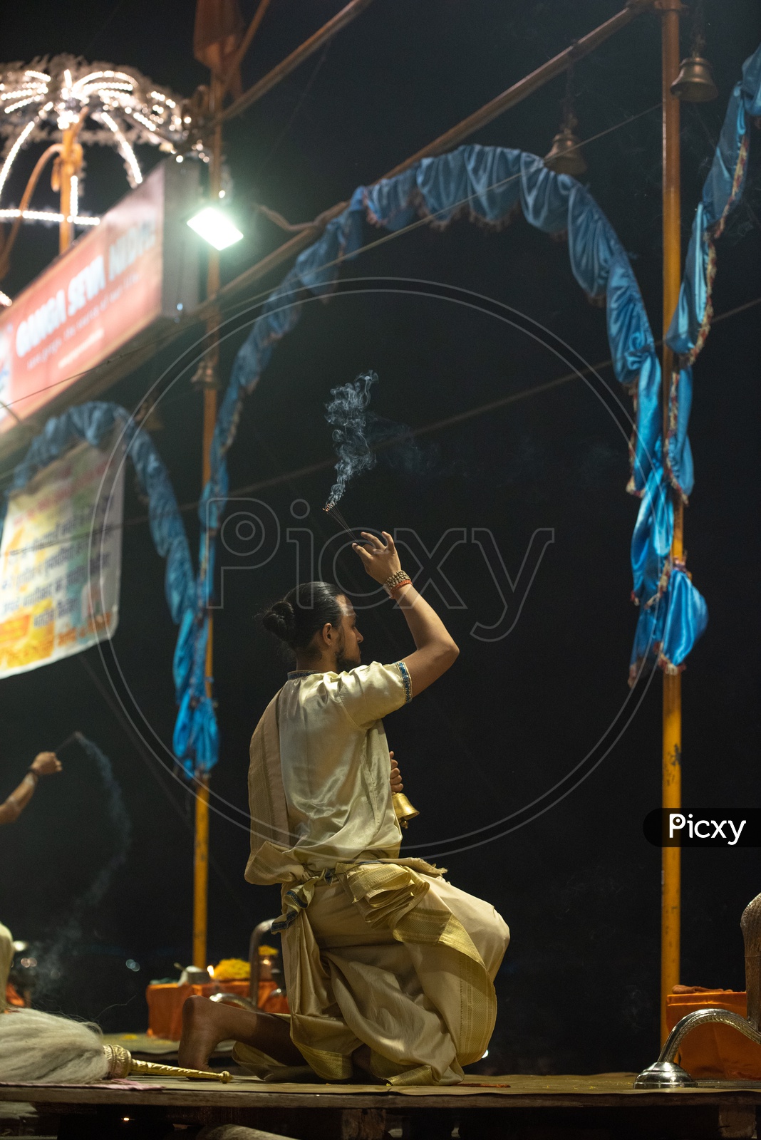 Indian Priests Performing Ganga Aarti Or Ganga Haarati  For Sacred River Ganga  in Varanasi