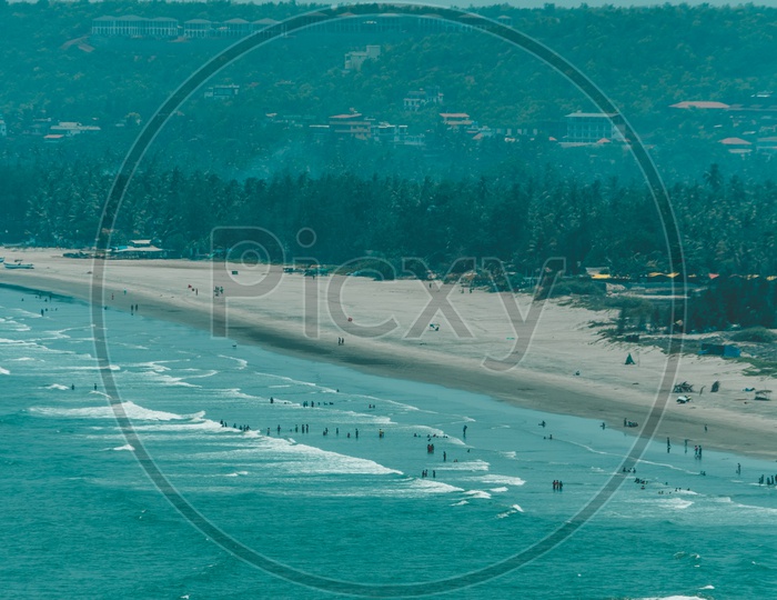 waves hitting sea shore near chapora fort of goa