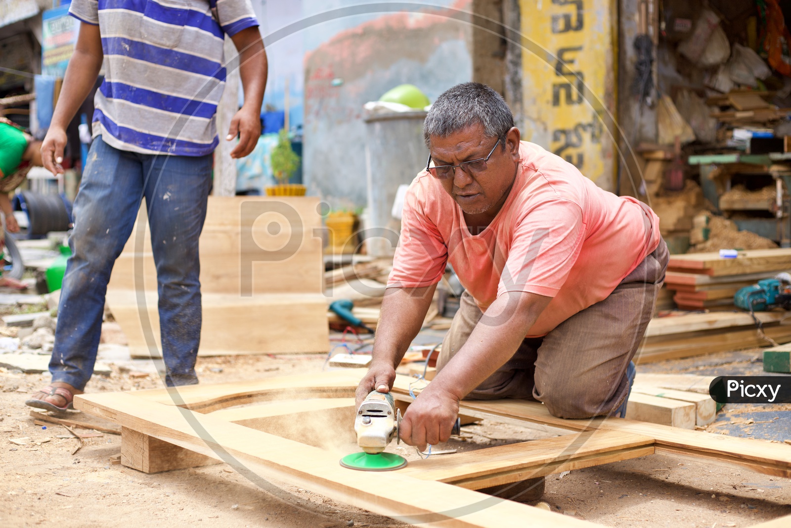 Carpenter working with grinder.