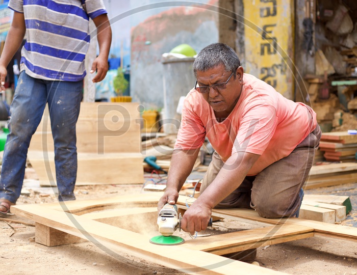 Carpenter working with grinder.