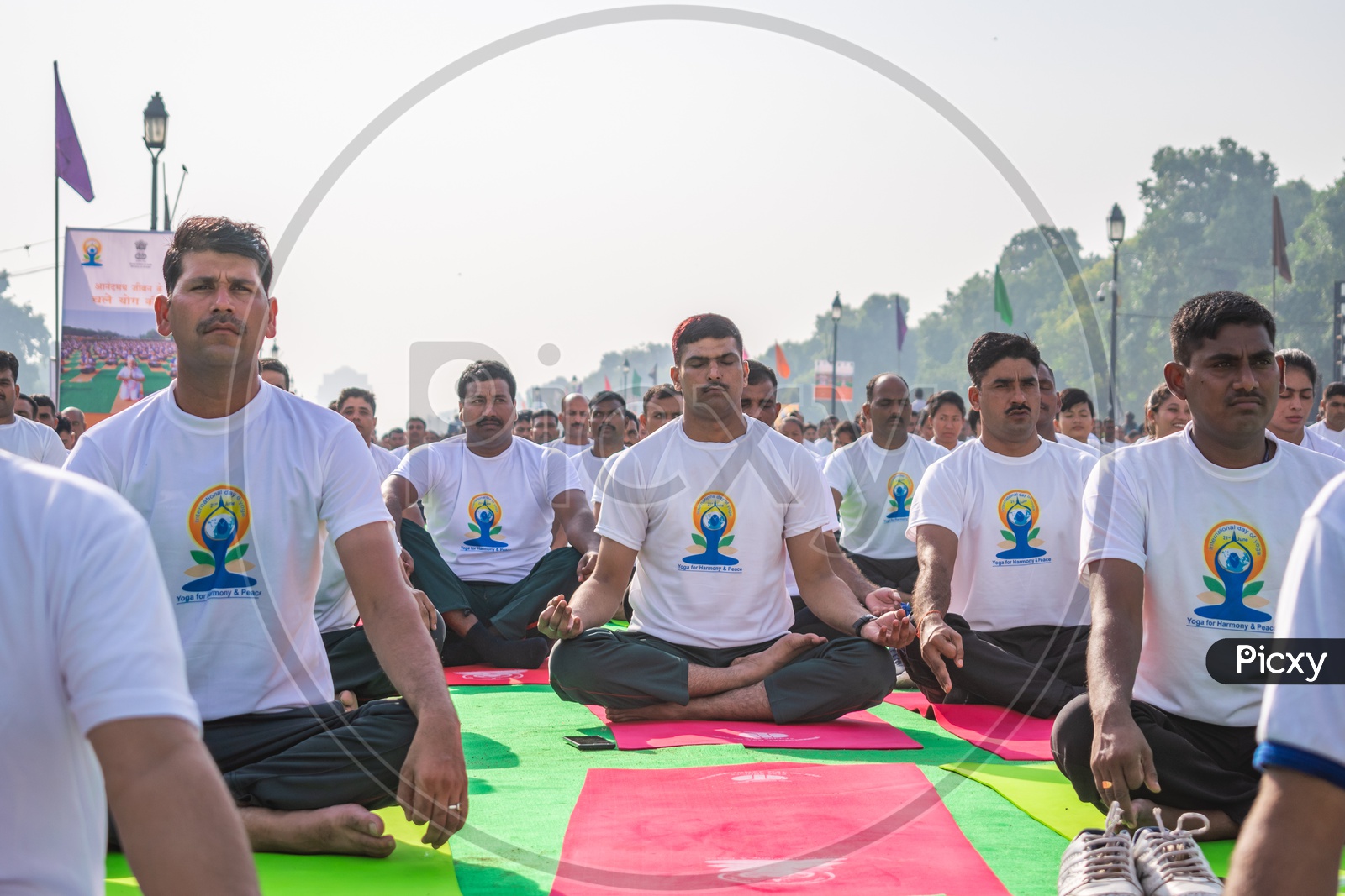 Men doing Kapalbhati Pranayama on International Day of Yoga at Rajpath, Delhi