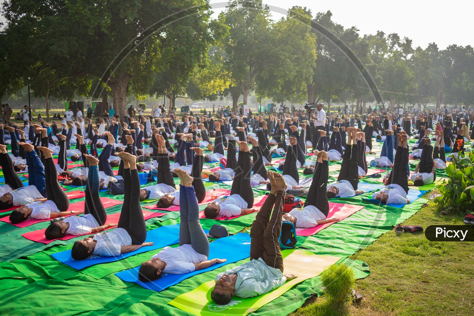 People doing Uttanpadasana yoga on the International Day of Yoga 2019 at Rajpath, Delhi