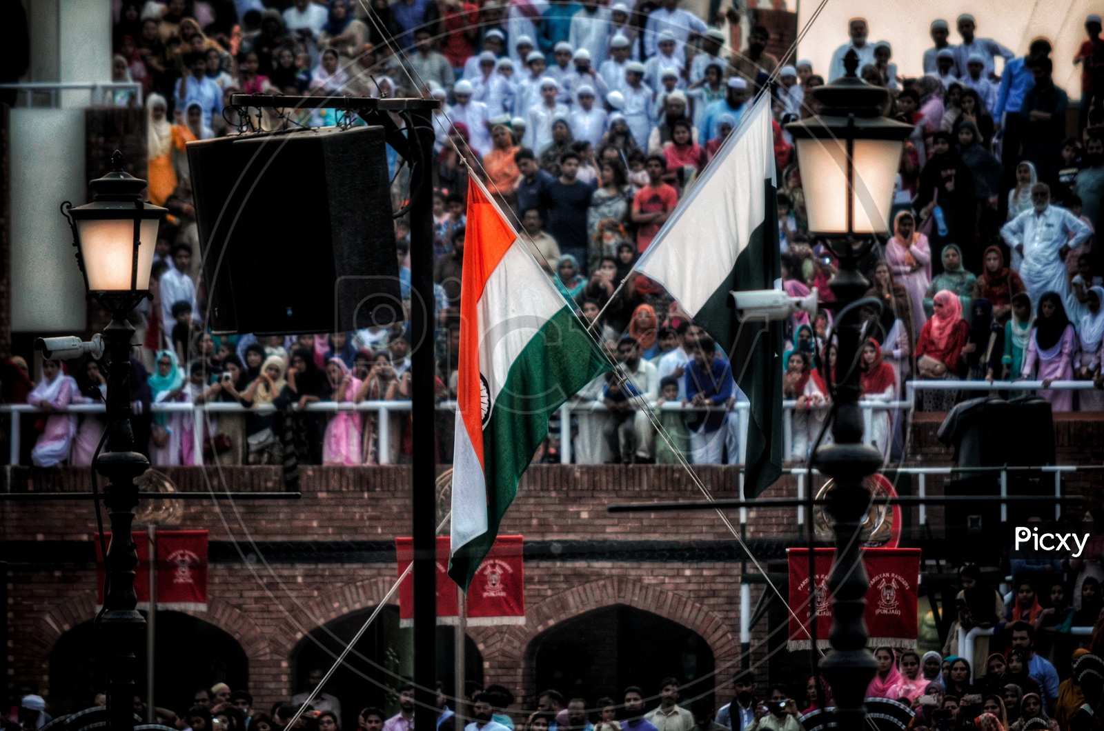 Wagah border ceremony ! When both the countries flag are summoned together so that no one will attack each other once the flag is put down until morning.