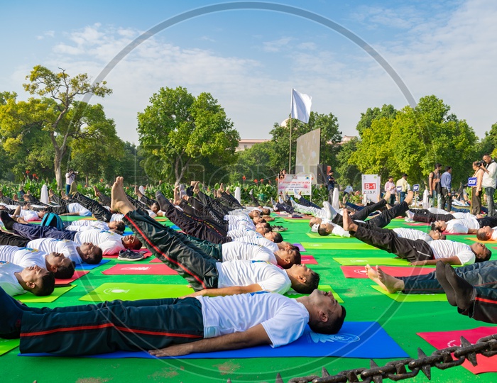 Men doing Uttanpadasana yoga on the International Day of Yoga 2019 at Rajpath, Delhi