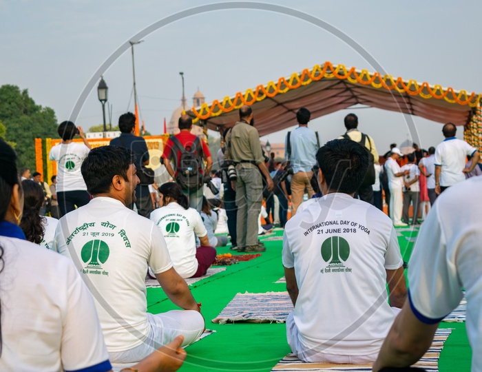 People wearing t-shirts of International Day of Yoga, 2019