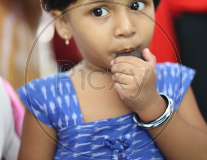 Child eating a biscuit