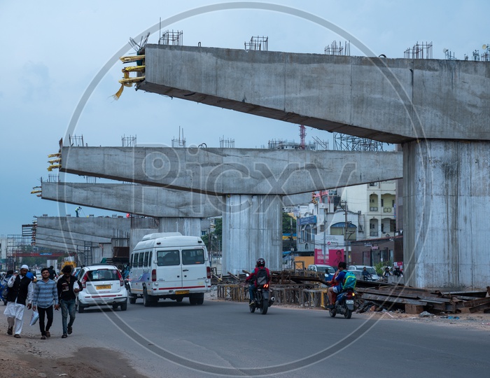 Under Construction Flyover  in Urban cities  With Pillars Construction and Commuting Vehicles