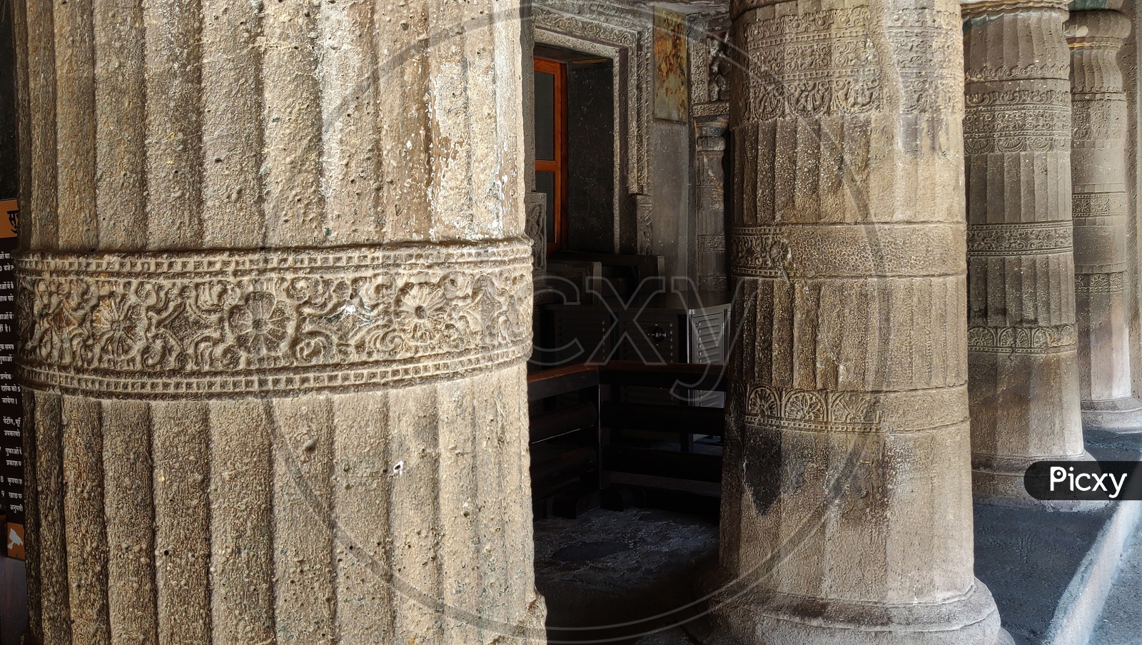 Image Of Ancient Stone Cravings With Architecture Of Pillars At Ajanta