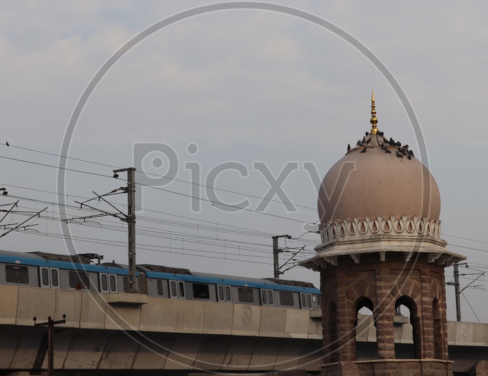 Architecture Of Mazamjahi Market With a Minar Or Dome Like Hover pillar