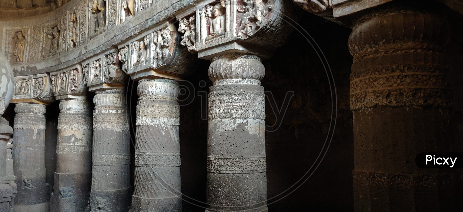 Ancient Stone Cravings Of  Ancient Buddhist temples  and Pillars  at Ajanta Caves    Or  Tourist Attraction Of  Ancient Caves At Ajanta in Deccan Plateau