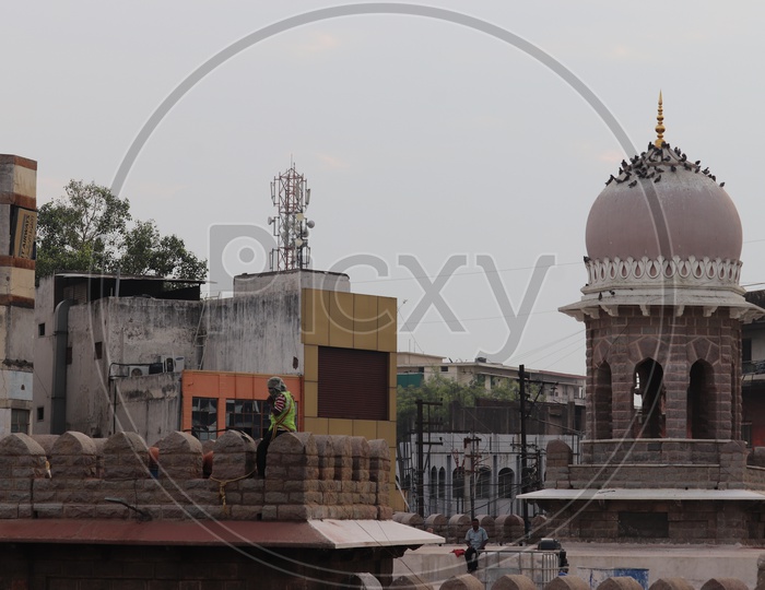 Architecture Of Mazamjahi Market With a Minar Or Dome Like Hover pillar