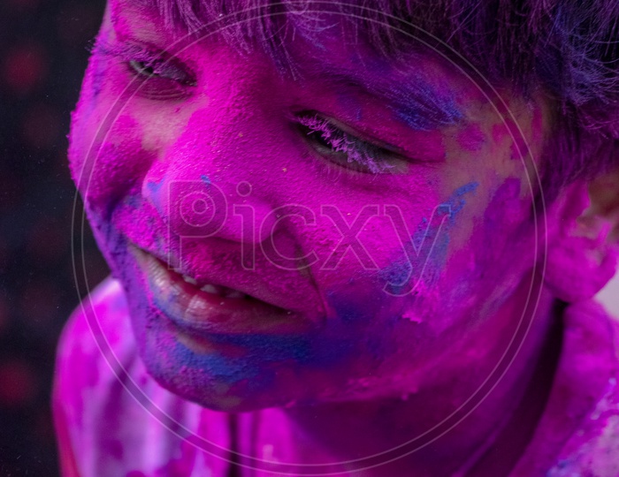 India boy filled in Holi colors