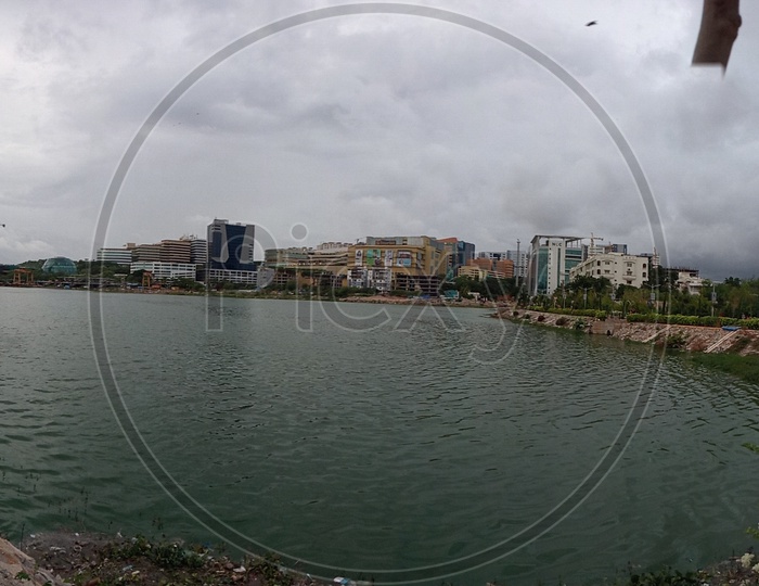 Panorama view of Durgam Cheruvu lake and Inorbit mall from Durgam Cheruvu lakefront park.