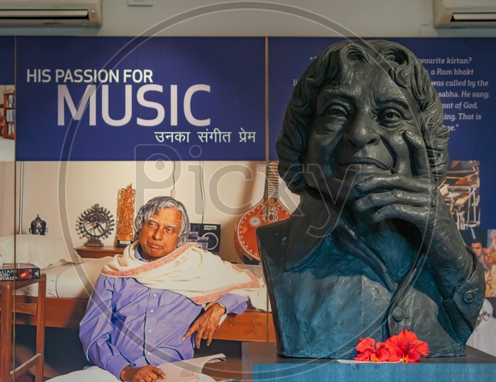 Dr. A.P.J Abdul Kalam statue and a picture showing his passion for music