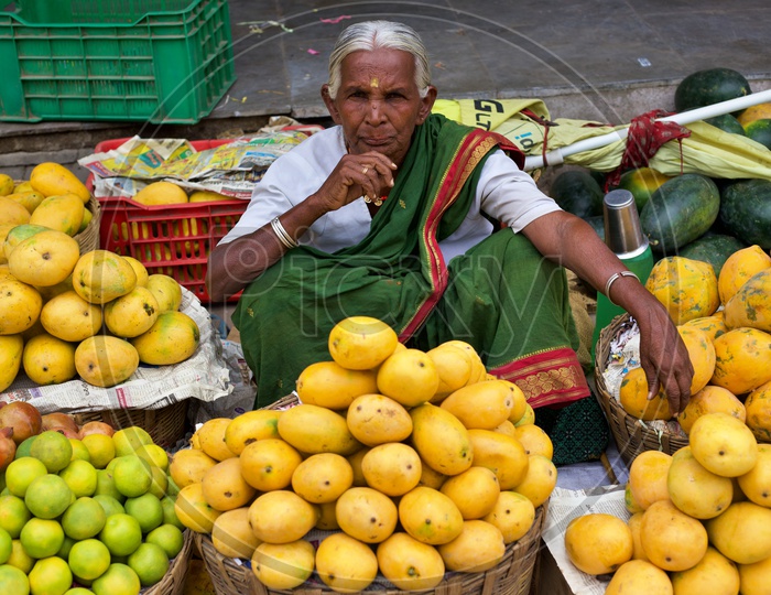 Old women selling mangos.