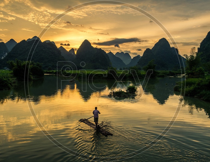 A Cormorant Fisher Man on River Li In Guilin China