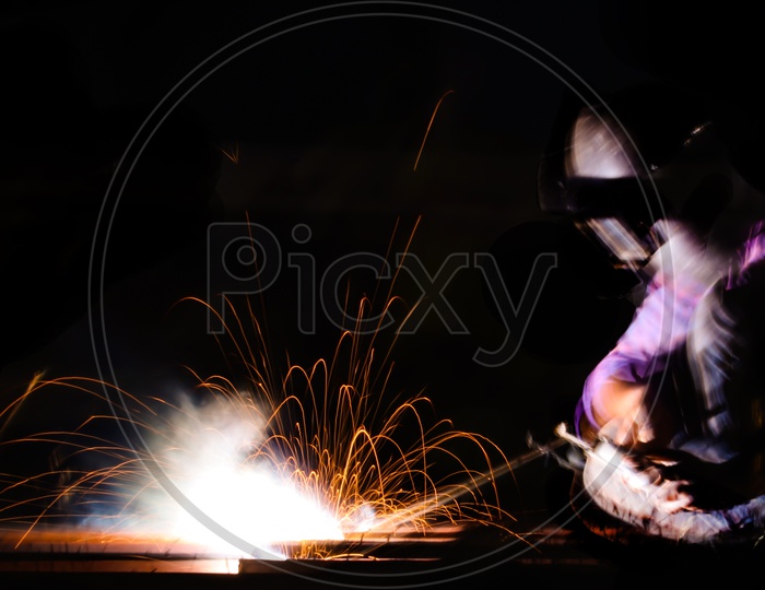 Man welding a spot long exposure shot